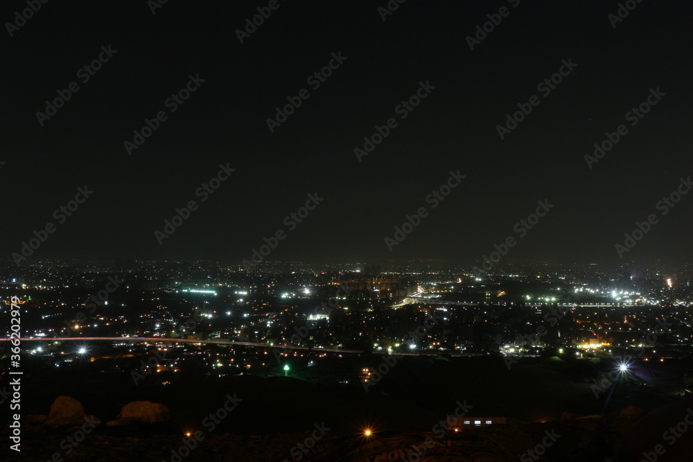Cityscape night over mount at Mukattam in Egypt 