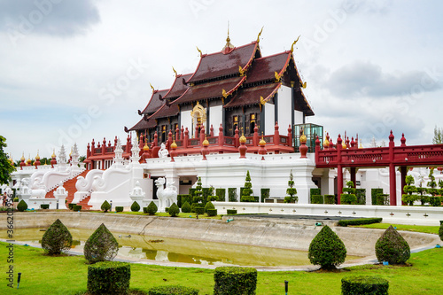 Royal Flora Rajapruek in Chiang Mai, Thailand, royal pavilion, beautiful mahogany and gilding temple, folded roof, daytime, in cloudy weather 