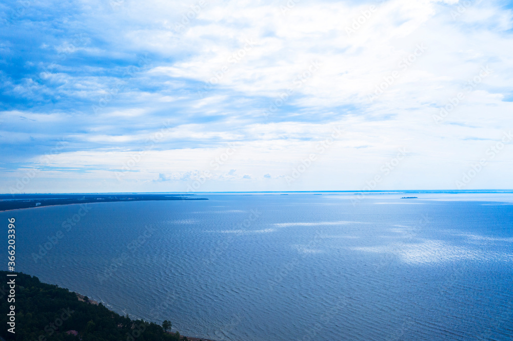 Aerial view of a blue sea water background. Drone view. Waves water surface texture. Aerial fly over blue ocean Aerial view of a blue sea water background. Drone view. Waves water surface texture. Aerial fly over blue ocean