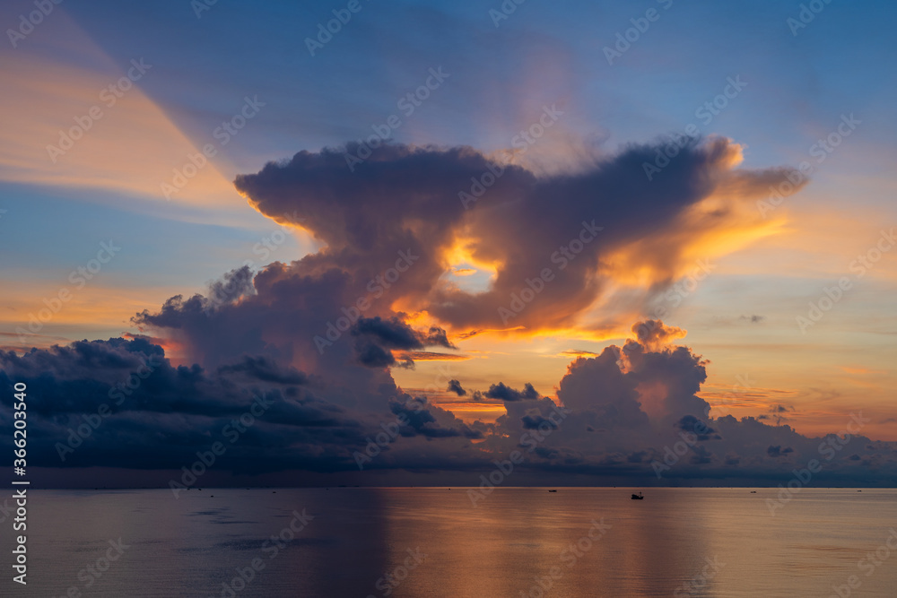 Sunrise on the island of Phu Quoc, Vietnam. Travel and nature concept. Morning sky, clouds, sun and sea water