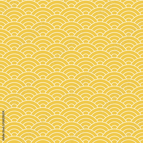 Japanese wave pattern. Seigaiha in yellow and white. Seamless ocean waves circles line background for wallpaper, textile, or other traditional decorative print. Symbol of tranquility.