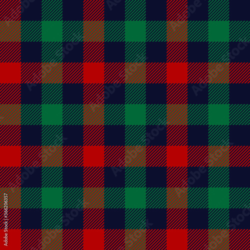 Gingham pattern in blue, red, green. Christmas stripes textured vichy check plaid for jacket, coat, skirt, tablecloth, or other modern New Year winter holiday fabric design.