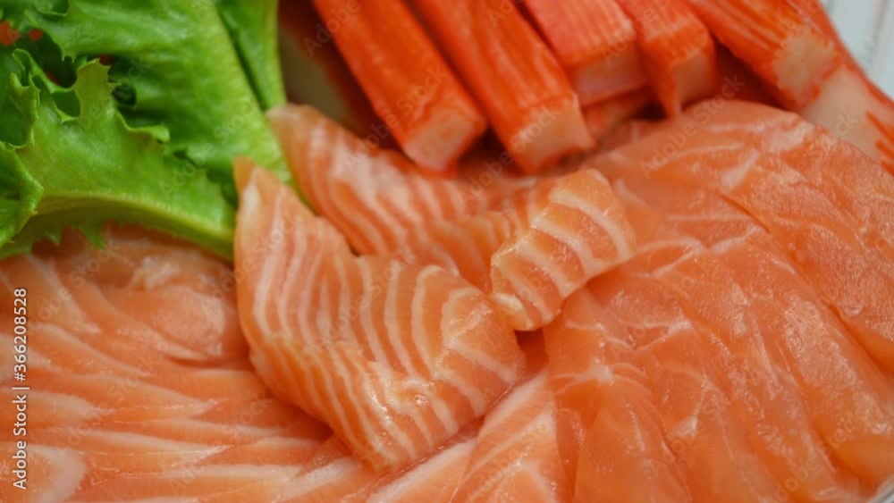 salad salmon sashimi and crab stick on plate, 4k rotating scene salad salmon sashimi and crab stick on plate, 4k rotating scene