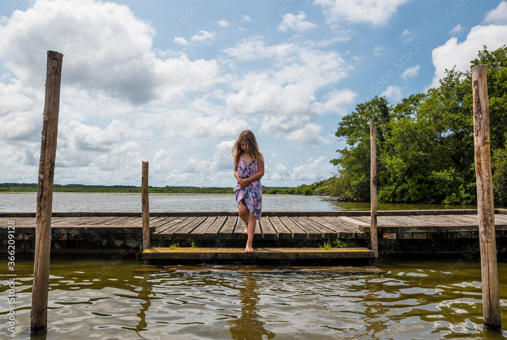 Fototapeta premium pretty young girl at lake Leon in south west France