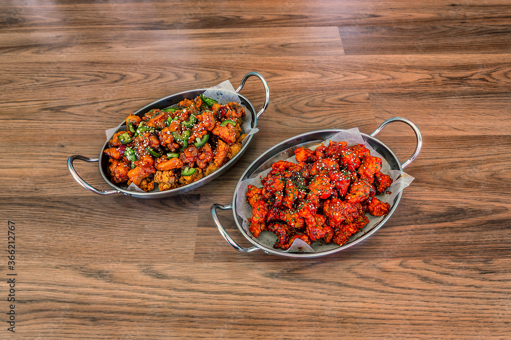 2 Flavors of Korean Chicken in Metal Dishes