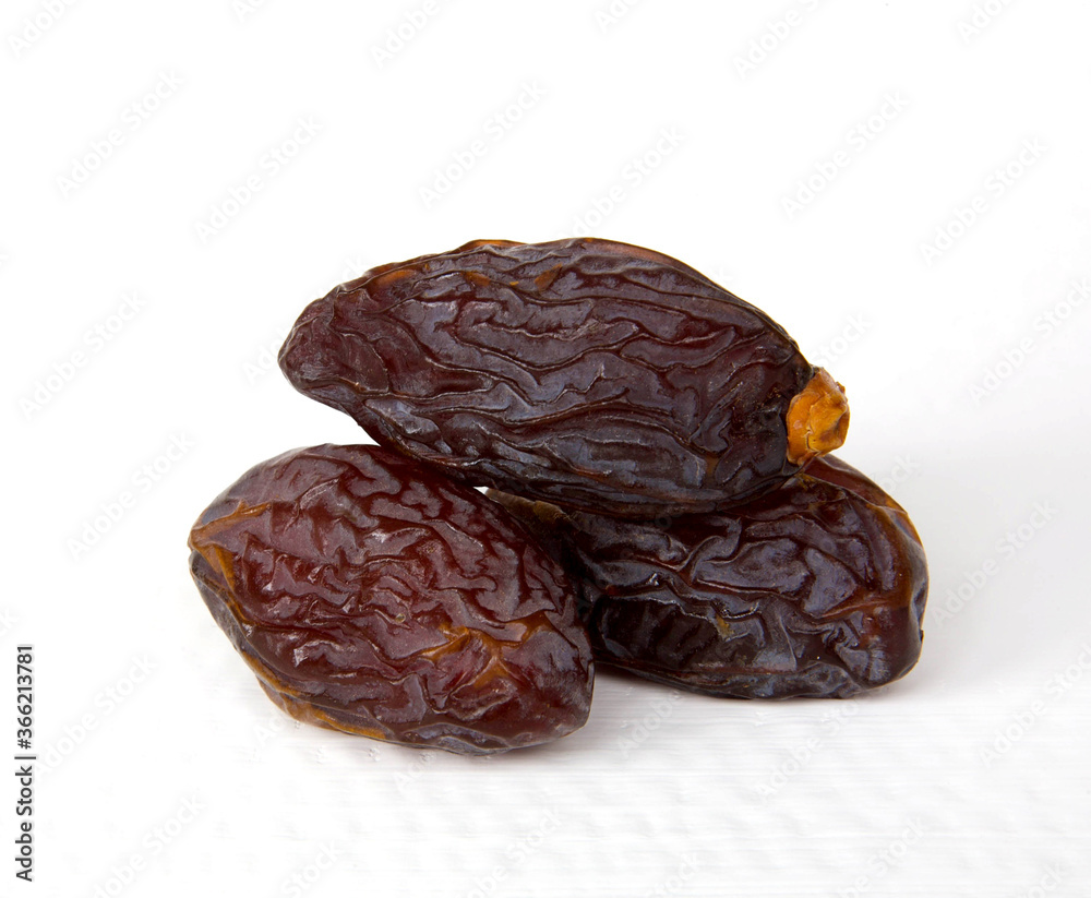 Royal large dates Medjool on a white background Royal large dates Medjool on a white background