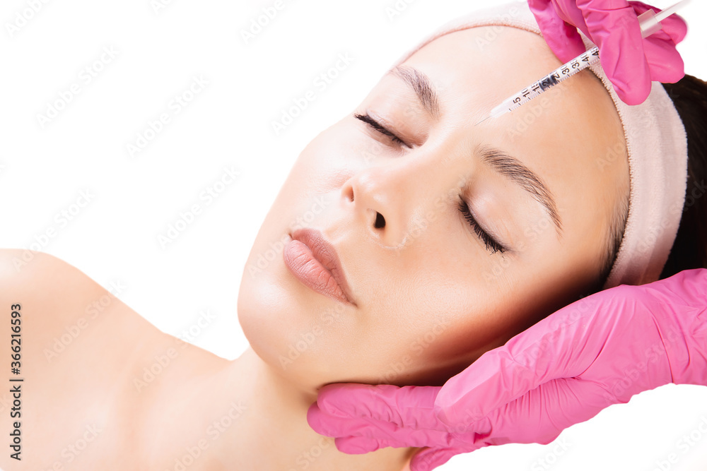 Woman getting rejuvenating facial injection beauty and cosmetology procedure for tightening and smoothing wrinkles on face skin