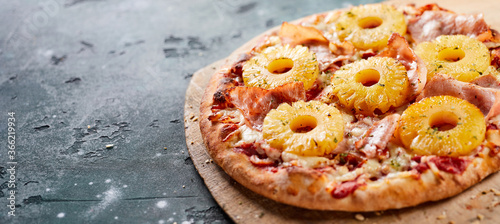 Tropical Hawaiian pizza with pineapple slices