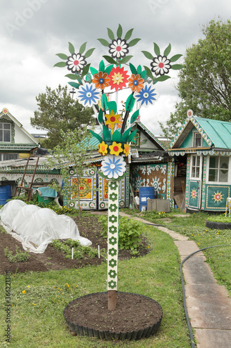 Old wooden traditional national rural Lobanov's house with carved windows, frames in Leshkovo village, Sergiyev Posad district, Moscow region, Russia. Russian folk style in wooden architecture. Summer photo