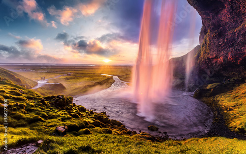 Breathtaking evening view of the most beautiful waterfall Seljalandsfoss at sunset. Wonderful picturesque scene. Amazing Icelandic scenery. Iceland the country of best Incredible nature locations.