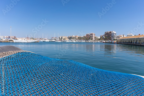 Fishing net in the background of the lagoon with yachts