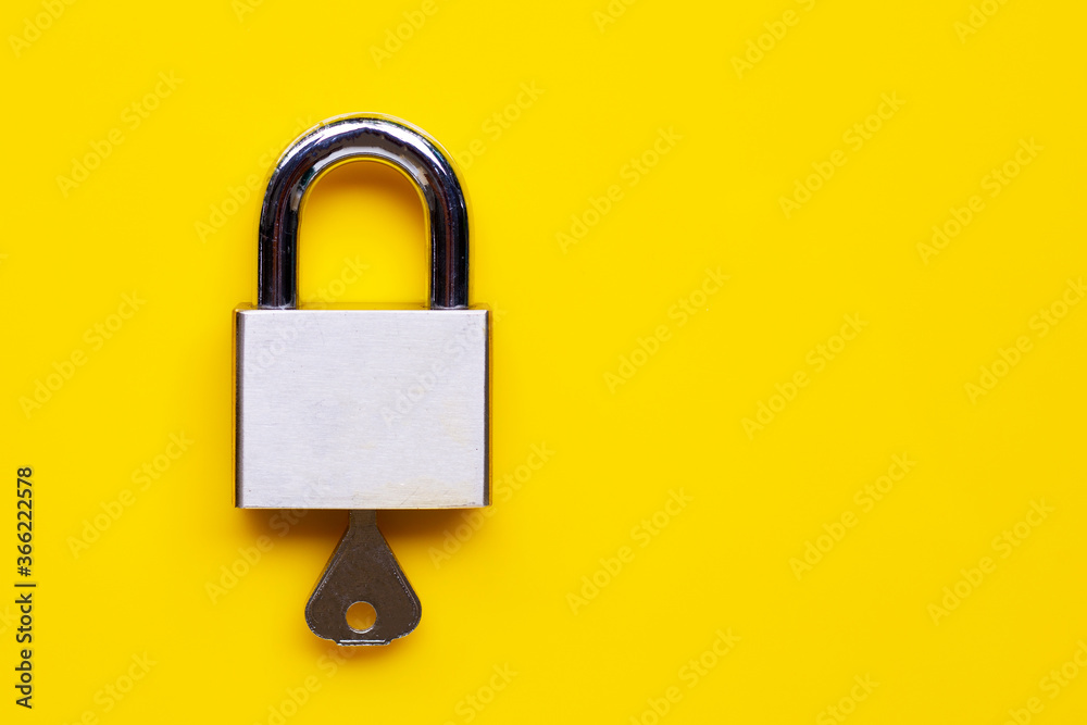 Lock and key on yellow background. Lock and key on yellow background.