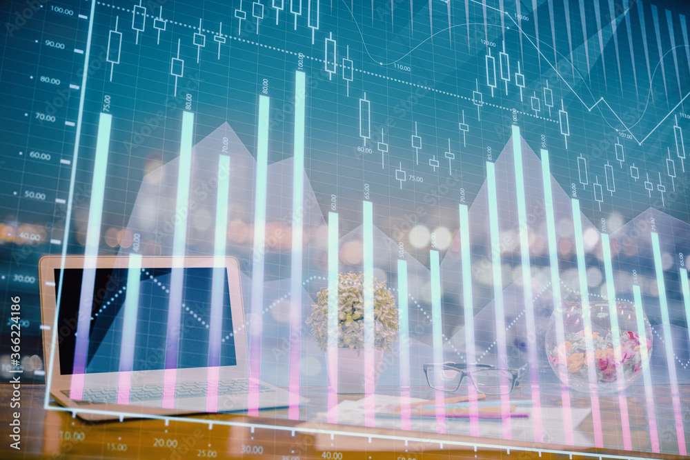 Forex graph hologram on table with computer background. Double exposure. Concept of financial markets. Forex graph hologram on table with computer background. Double exposure. Concept of financial markets.