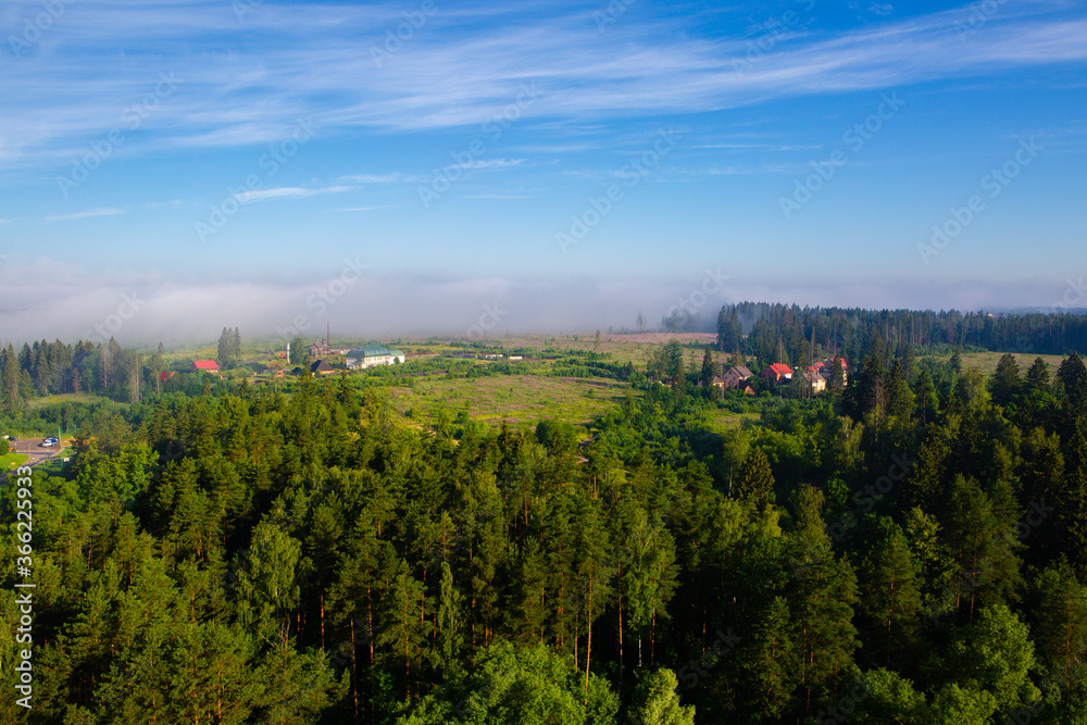 Landscape view of the village in the fog