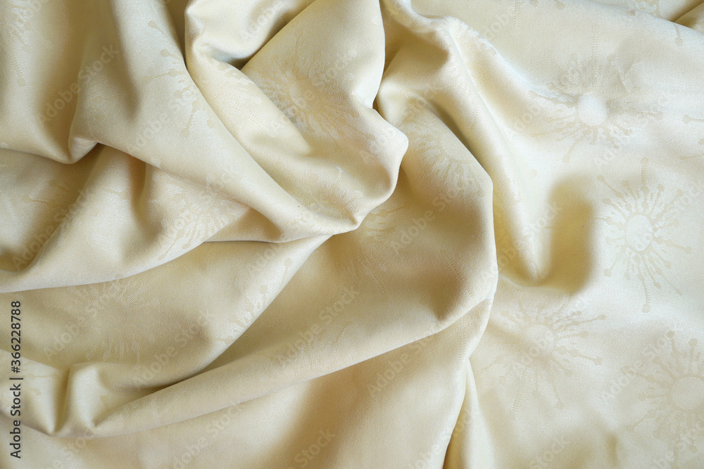 texture of beige textile material in a fold for background