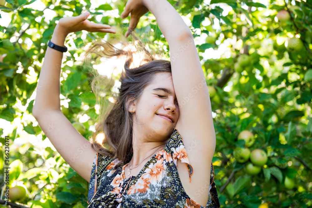 Good morning. Awakening in the morning. rural life. Girl stretching. Portrait of a beautiful smiling girl outdoor. Morning in the village, summer morning. Good morning. Awakening in the morning. rural life. Girl stretching. Portrait of a beautiful smiling girl outdoor. Morning in the village, summer morning.