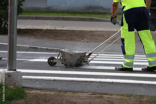 Thermoplastic road marking. Pedestrian crossing implementation.