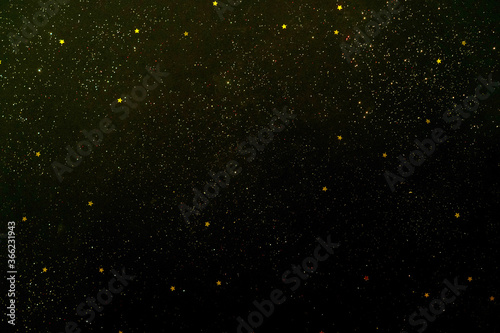 Golden stars on a black background.