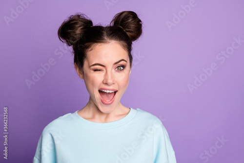 Portrait of lovely energetic candid girl enjoy autumn holiday wink blink wear sportive clothes isolated over vivid color background