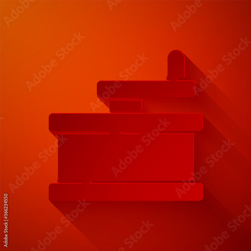 Paper cut Manual grinder icon isolated on red background. Paper art style. Vector Illustration.