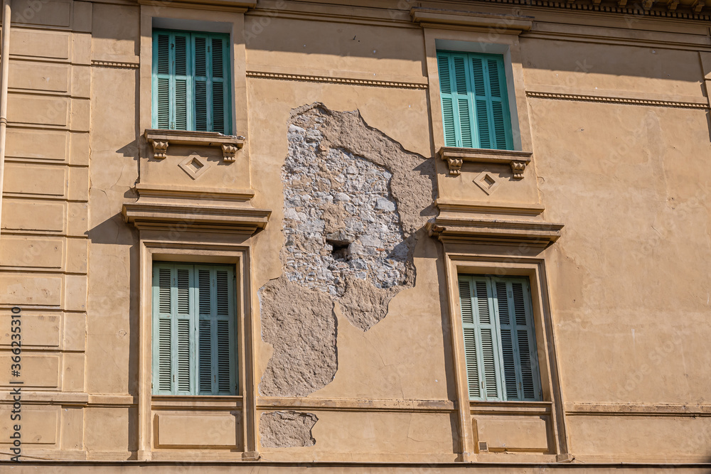Damaged facade of an old building in french Provence