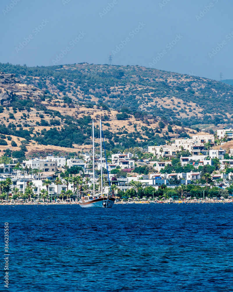 People are playing water sport in Gumbet Gulf in Bodrum.