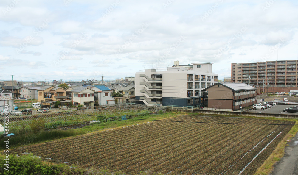 View of a rural town with the paddy fields along the way to Nara, Japan