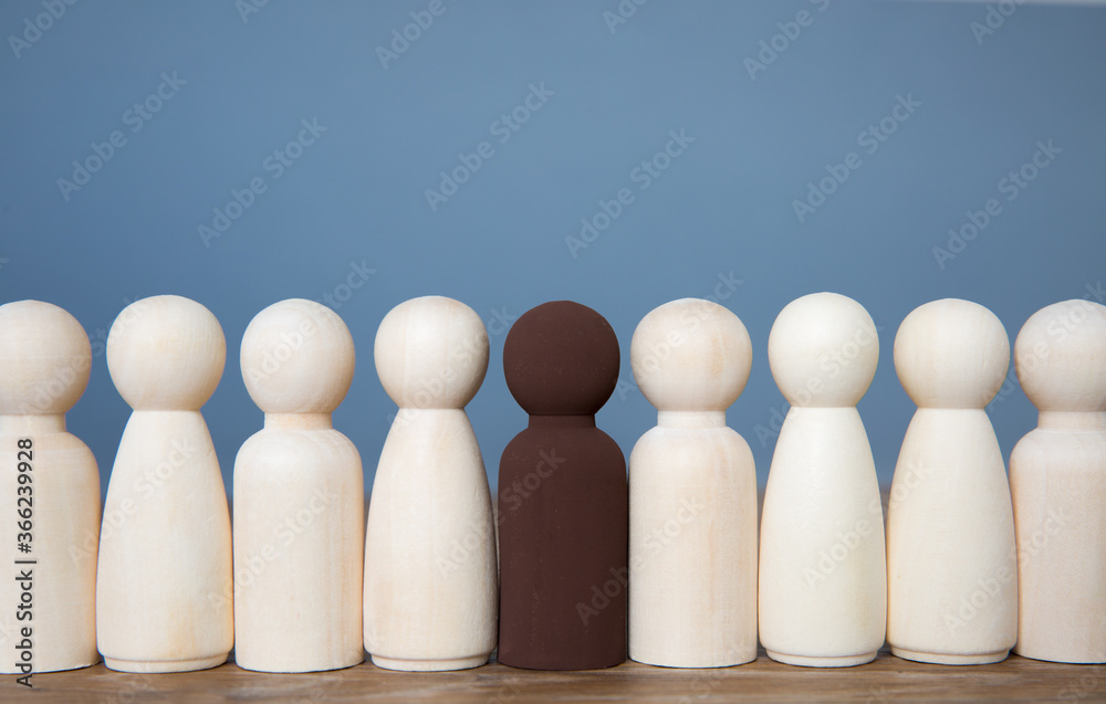 A lone black person integrating successfully with a group of white people A lone black person integrating successfully with a group of white people