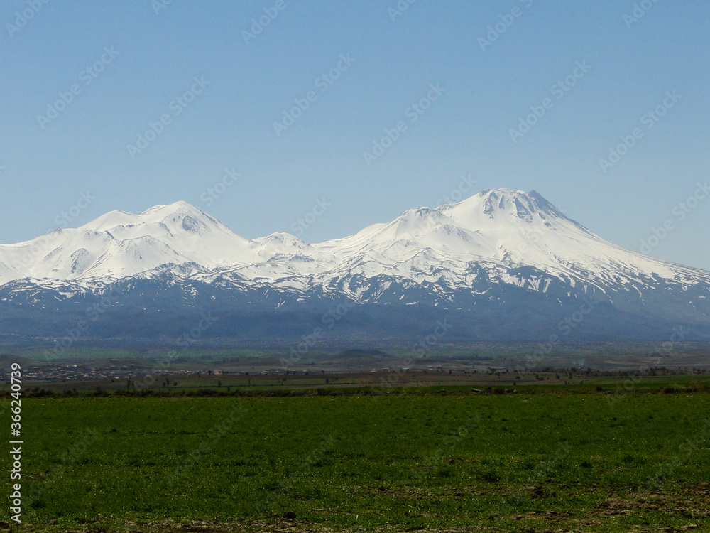 Panoramic Cappadocia landscape view of Mount Erciyes in countryside in spring season, the highest mountain in Cappadocia in Turkey.