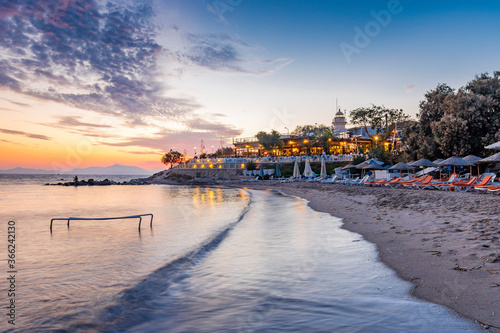 Huseyinburnu lighthouse night view in Turgutreis Town in Turkey. photo