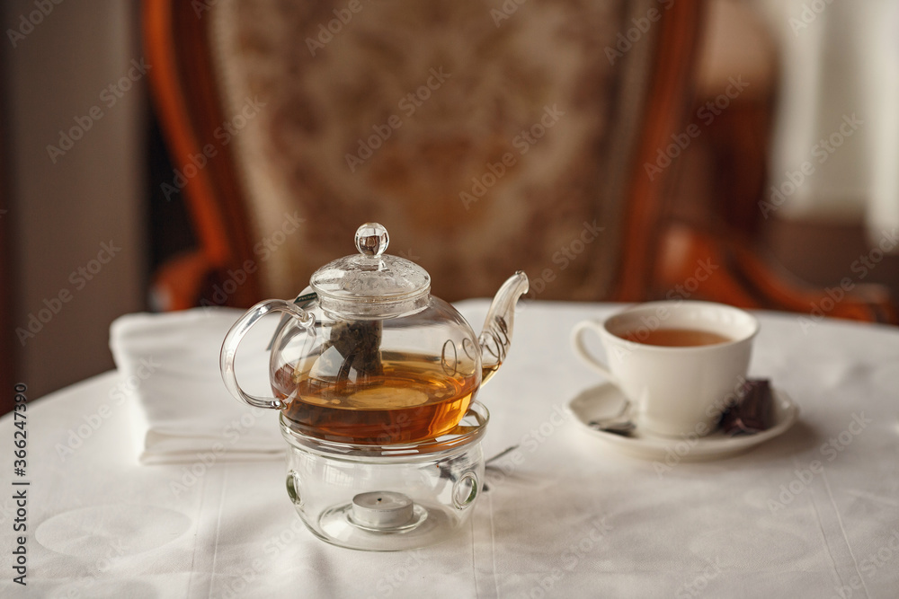 Tea Party with sweet cakes over table background in a charming classic restaurant Tea Party with sweet cakes over table background in a charming classic restaurant