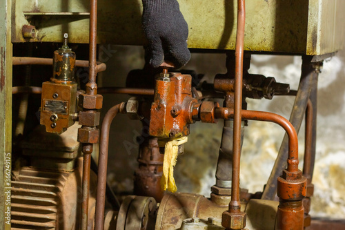 close up of hand with oil regulator