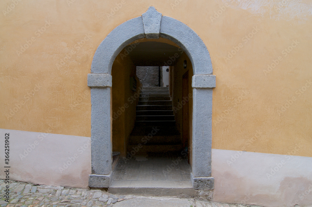 Traditional alley entrance taken in the old village of Bigorio, Switzerland