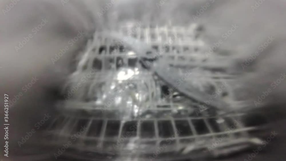 Slow motion. The master repairs the dishwasher and checks the operation