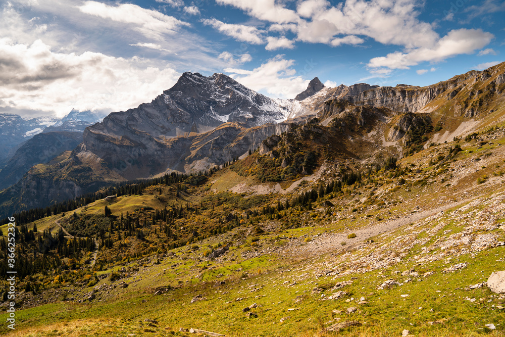 Beautiful snowy mountains in Switzerland during late summer hiking
