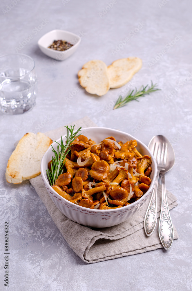 Fried chanterelle mushrooms with onions and rosemary