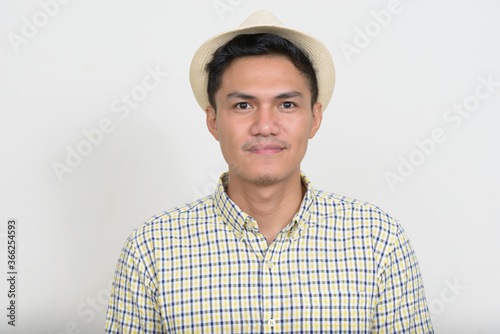 Portrait of handsome Asian tourist man wearing hat