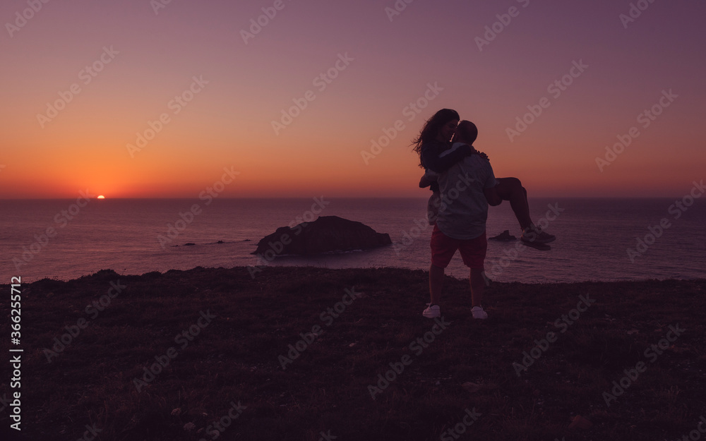 The couple against the beautiful sunset