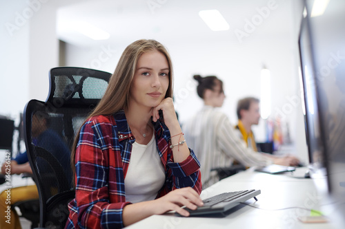 casual business woman working on desktop computer
