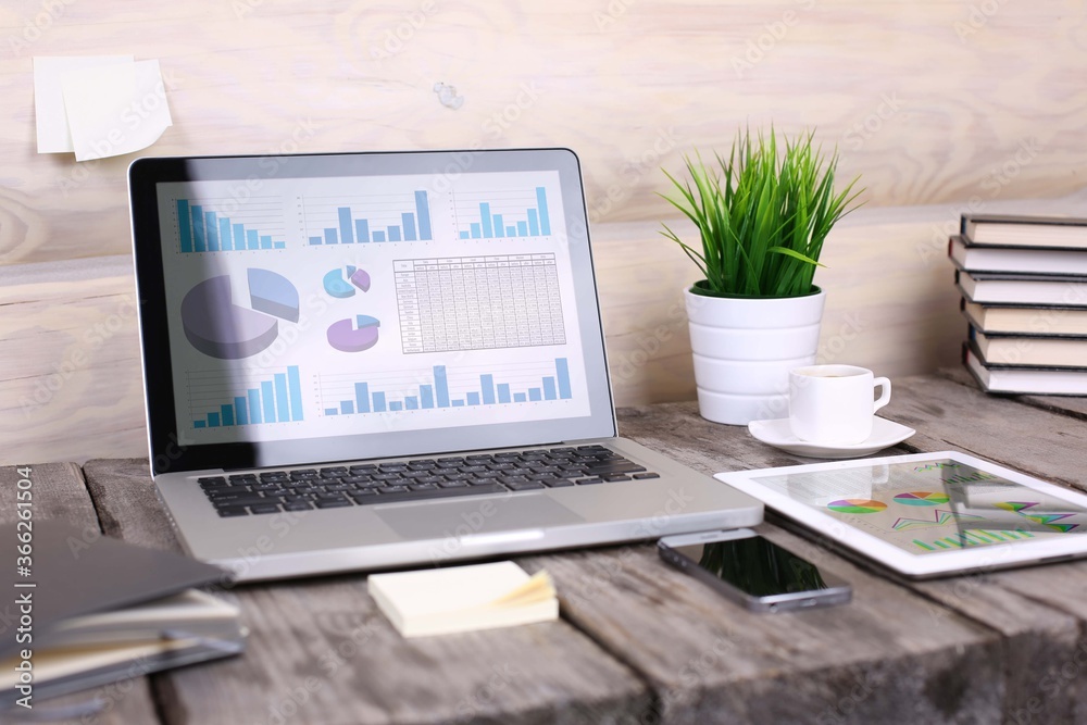 Fototapeta premium analyzing statistics on laptop screen, working with financial graphs charts online, using business software for data analysis .and project management concept, rear close up view