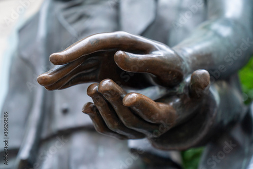 female hand over male, sculpture hands closeup