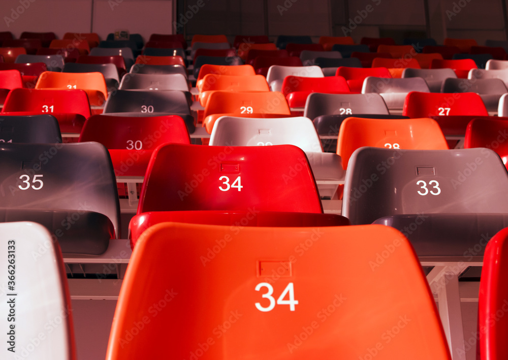 Fototapeta premium row of empty stadium seats colored