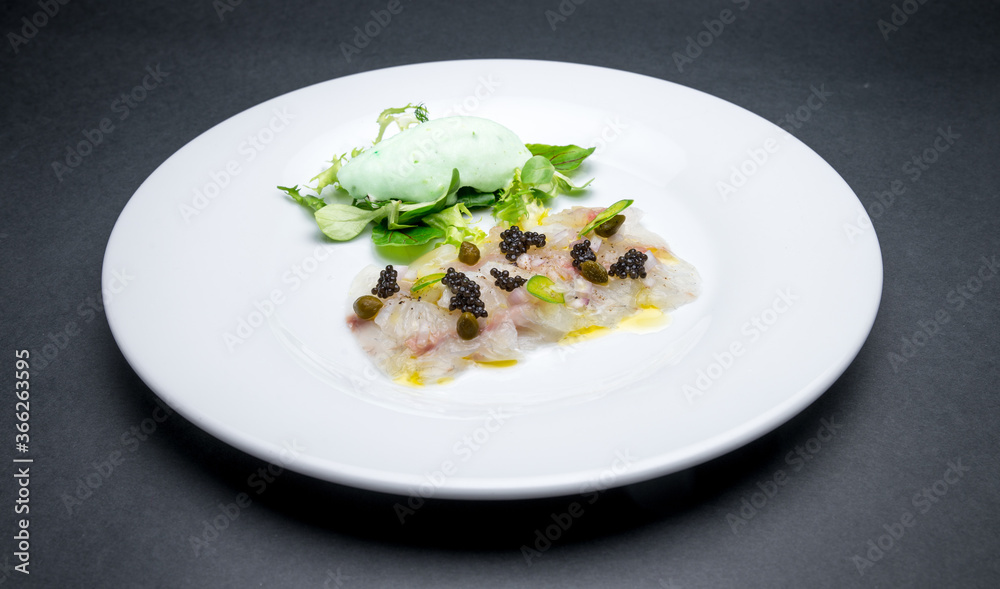 Fresh fish carpaccio with black sturgeon caviar Fresh fish carpaccio with black sturgeon caviar