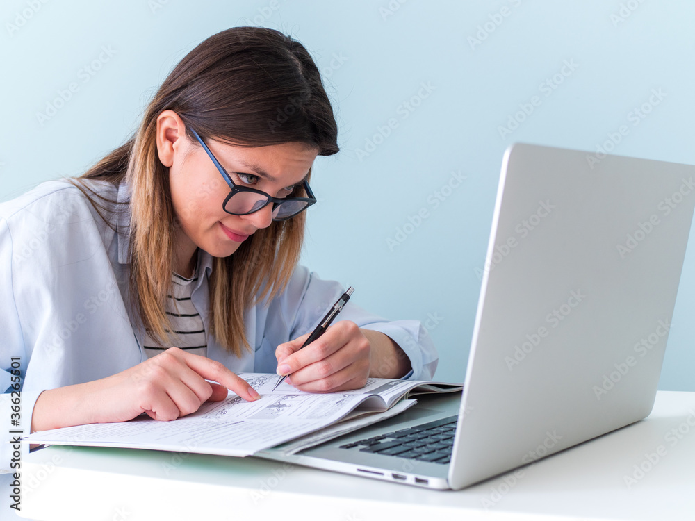 Distance learning online education. Woman studying with laptop, watching webinar Distance learning online education. Woman studying with laptop, watching webinar