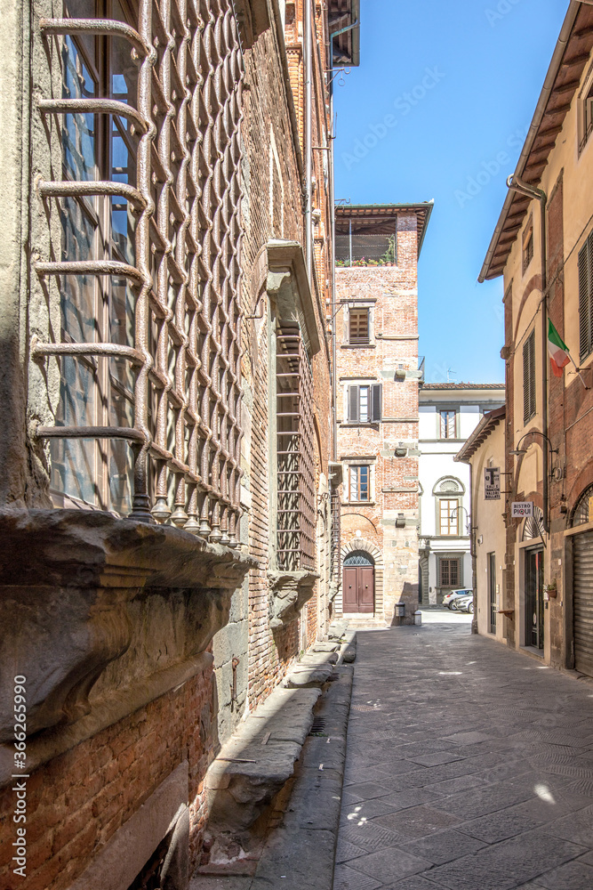 Street of Lucca in Italay, Tuscany. Hot summer day in an italian city with medieval architecture.