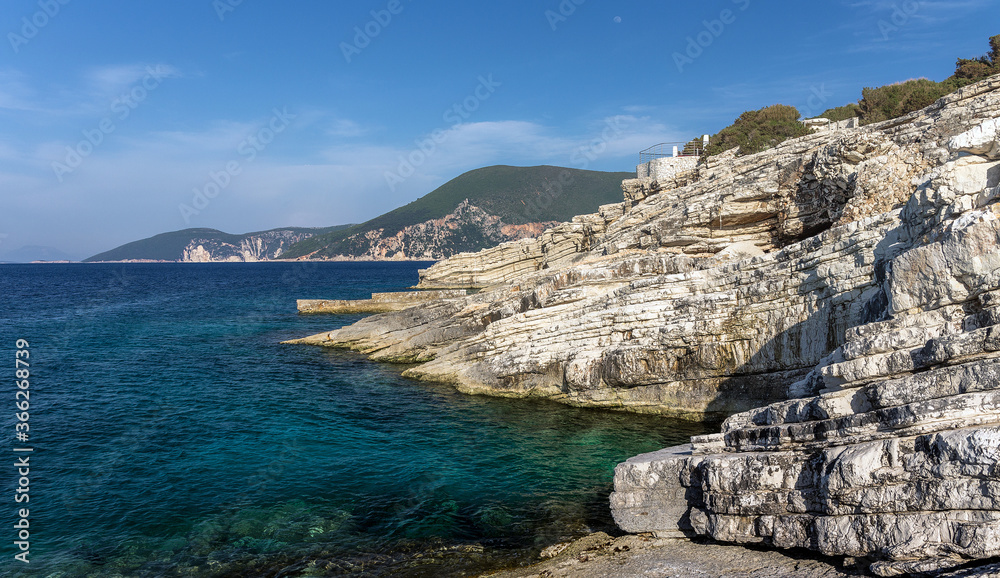 Natural seascape in the Greece. Seascape with rocky beach, turquoise water. Amazing nature Landscape. Wonderful summer day on the Emblisi beach. Kefalovia island.