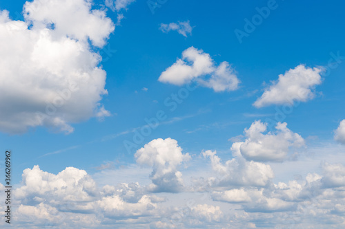 Cirrus clouds on a sultry summer day. A rare view of cirrus clouds on a calm day. Spindrift clouds. Background. Landscape.