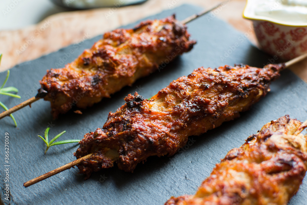 Homemade kebabs served with garlic sauce and rice.