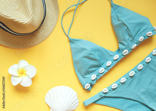 set of summer beach accessories on a yellow background