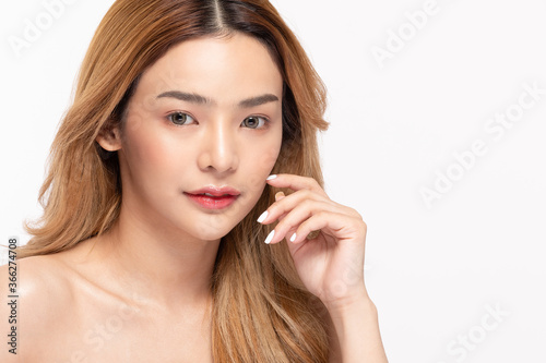 Beautiful Asian young woman touching soft cheek smile 